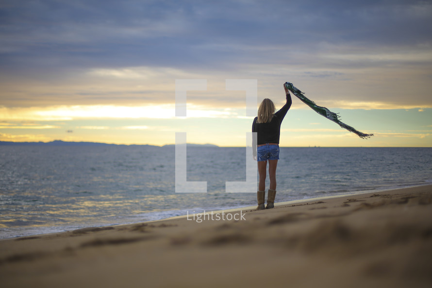 woman standing on a beach 