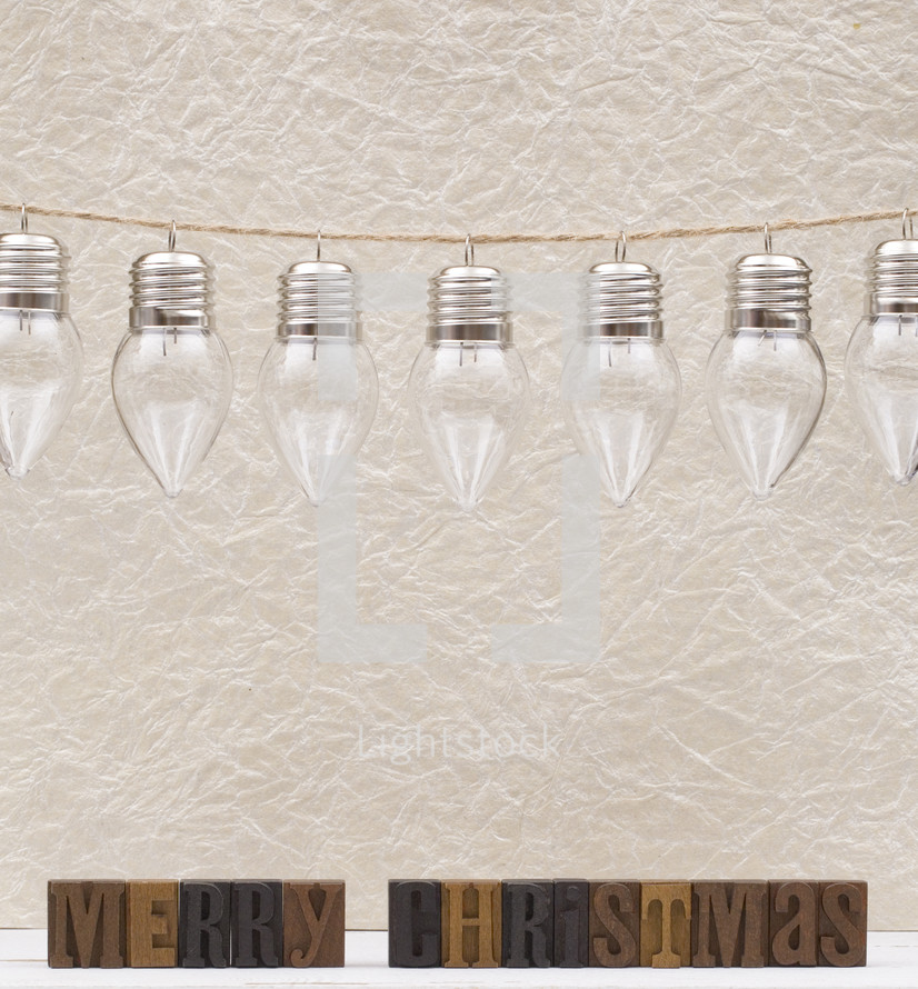 clear glass bulbs hanging on strings 