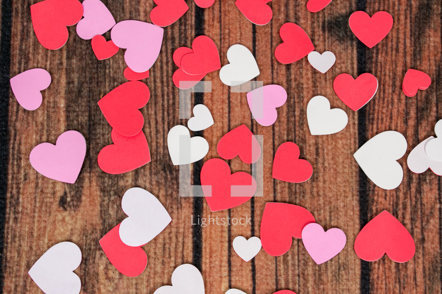 paper hearts on wood 
