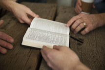 men's group with a Bible 