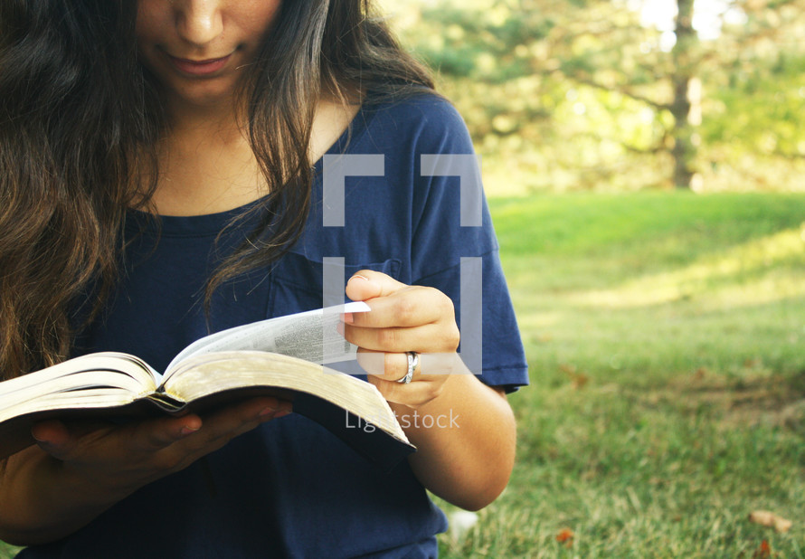 a young woman reading a Bible, girl, female