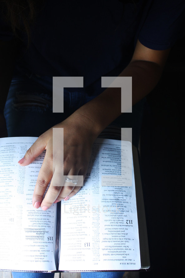 a teen girl reading a Bible 