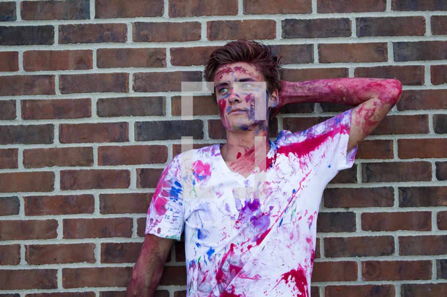 young man covered in paint 