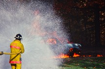 firefighter putting out a fire 