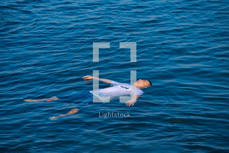 man floating on his back 