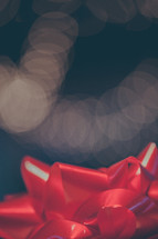 bokeh lights and a red bow