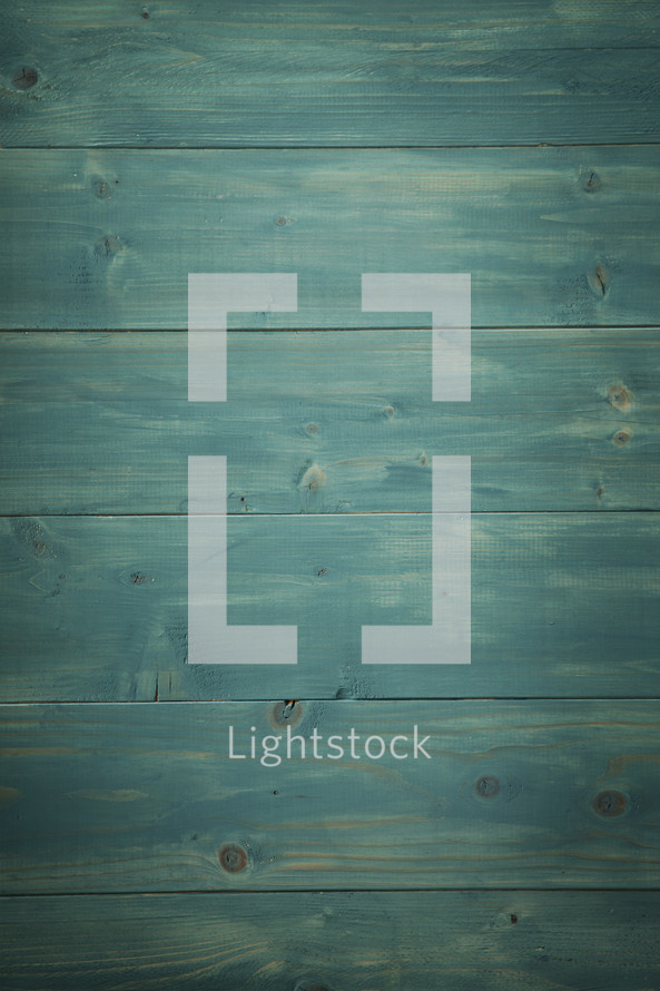 Teal, weathered wood background.
