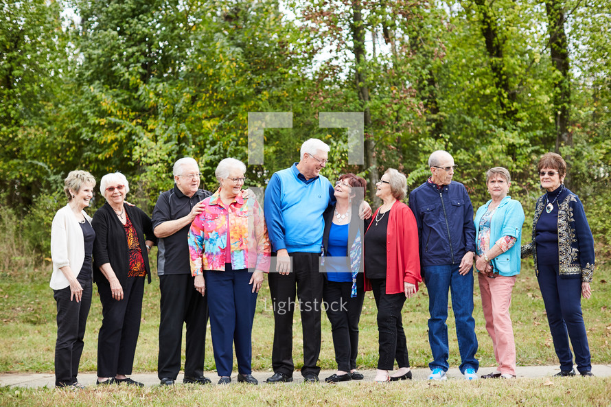 senior citizen fellowship group standing together 