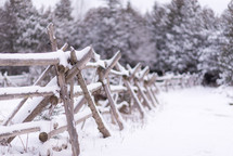 snow on a fence 