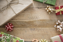 border of Christmas presents on wood 