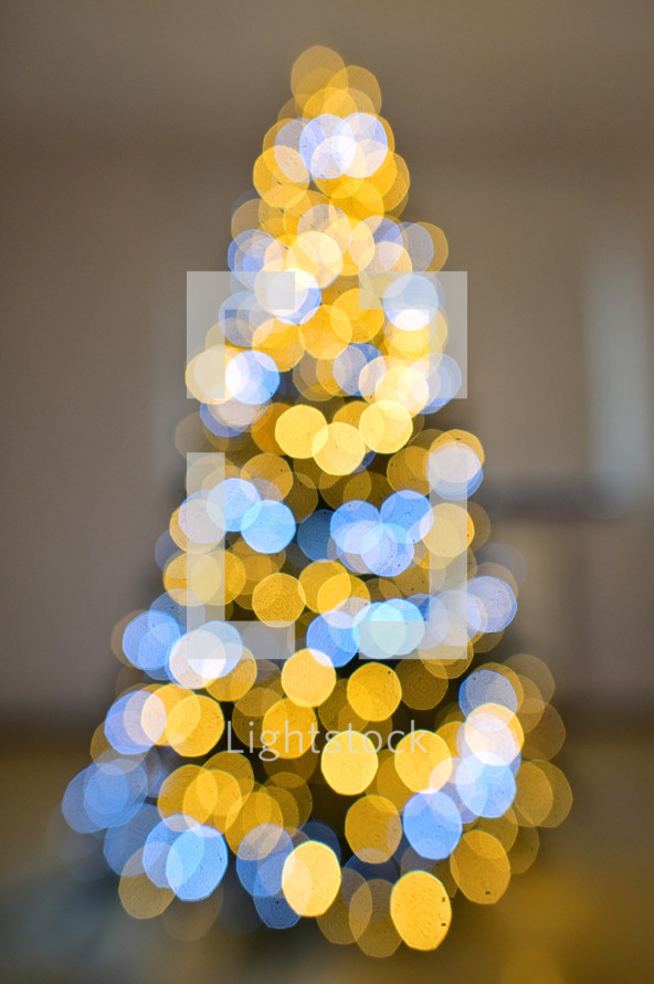 Christmas tree of gold and white bokeh lights