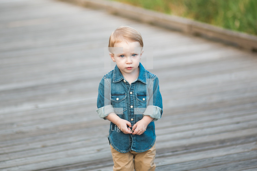 toddler boy in a denim shirt 