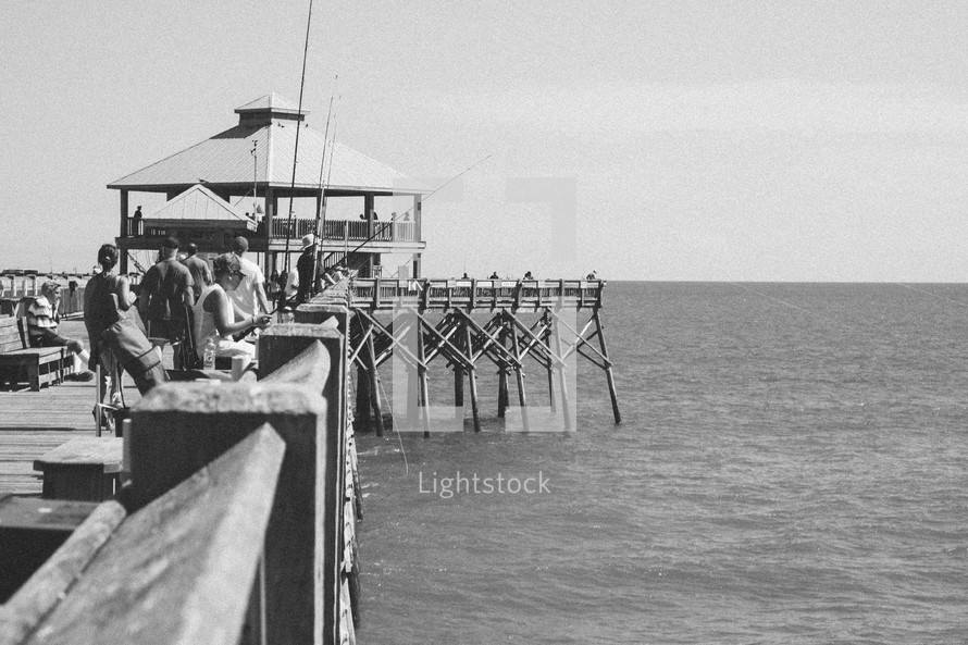 fishermen on a fishing pier 