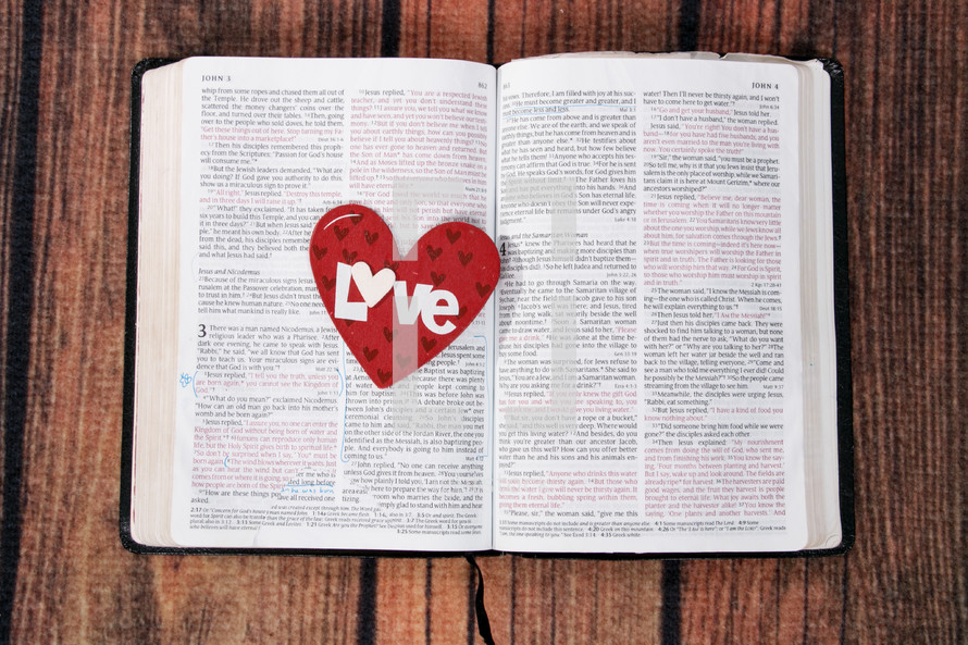 red heart on the pages of a Bible 