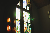 light of God shining through a church's stain glass window