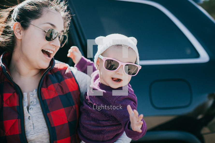 mother and infant in sunglasses 