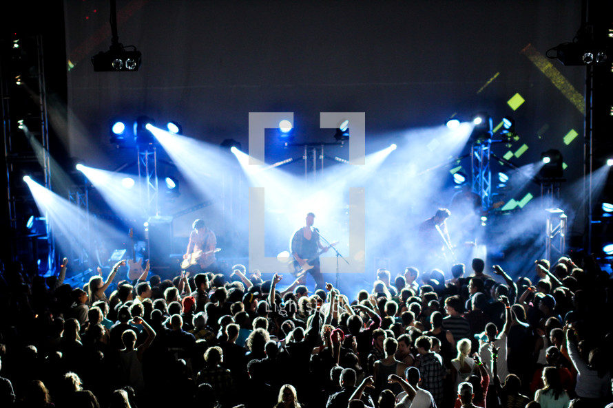 Silhouette of audience at a Christian rock concert.
