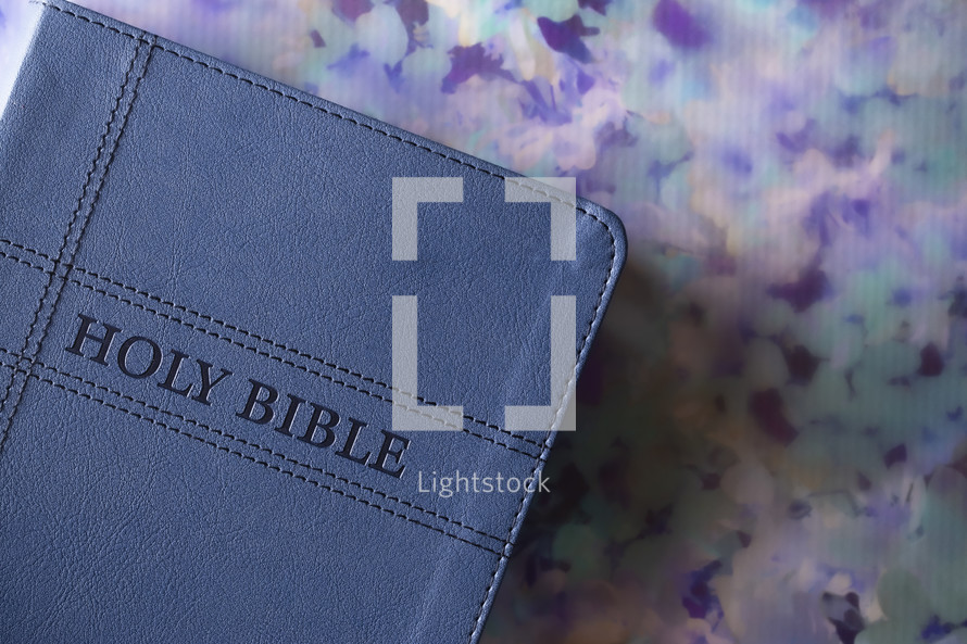 Blue Bible on floral pattern 
