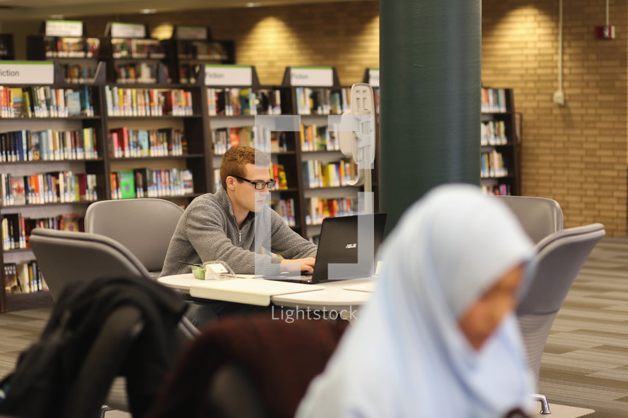 students studying in a library 