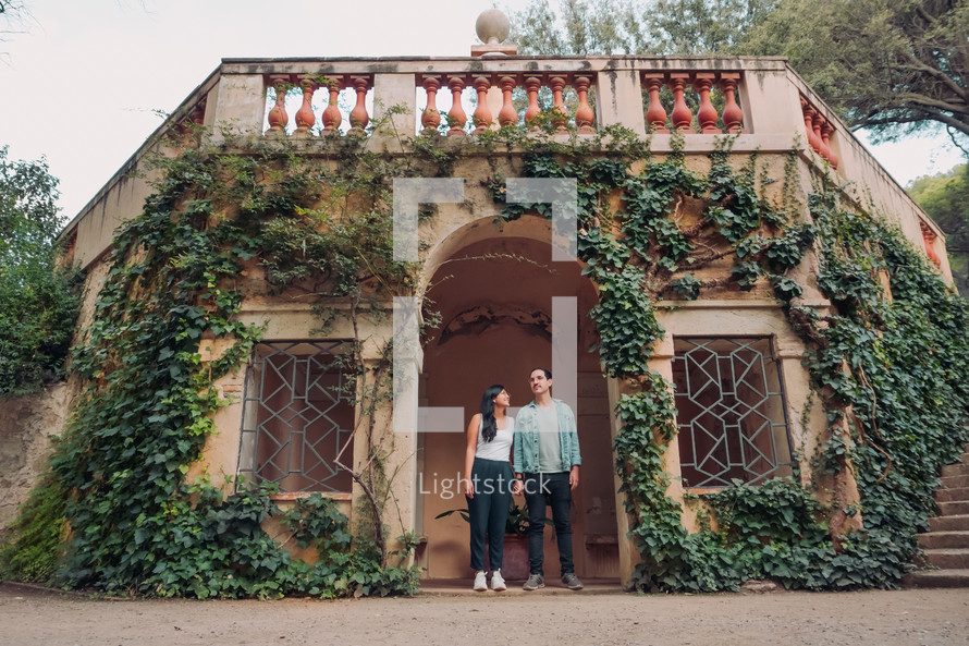 portrait of a couple surrounded by vines 