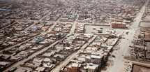 Aerial view of a city below 