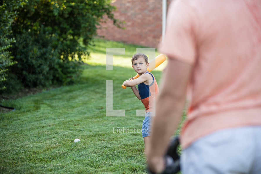 father and son playing baseball