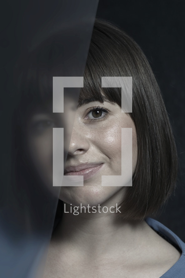 half occluded face - Portrait Young Woman in Studio
