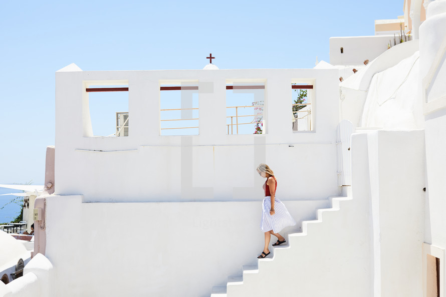 woman walking down steps in Greece 
