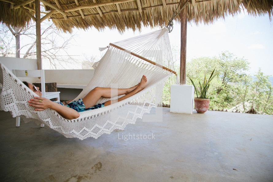man napping in a hammock 
