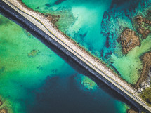 aerial view over a coastal bridge 