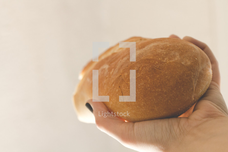 hand holding bread 