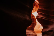 narrow openings between red rock cliffs 