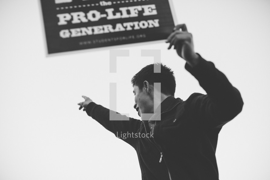 Young man celebrating during a pro life march