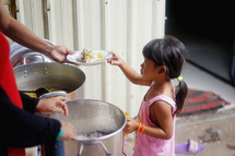 serving food to a hungry child 
