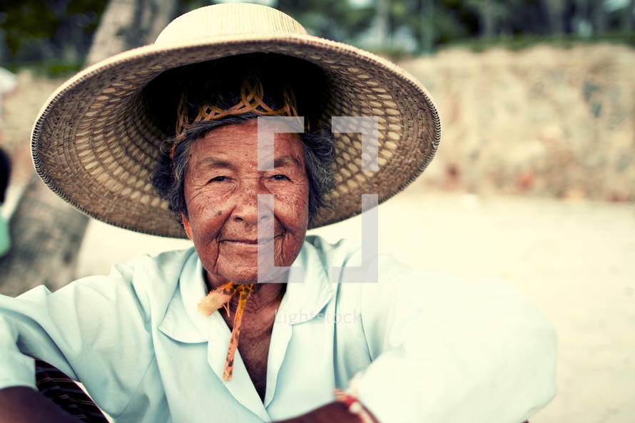 elderly woman in a straw hat 