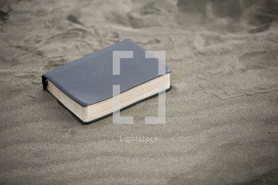 Bible on the sand 