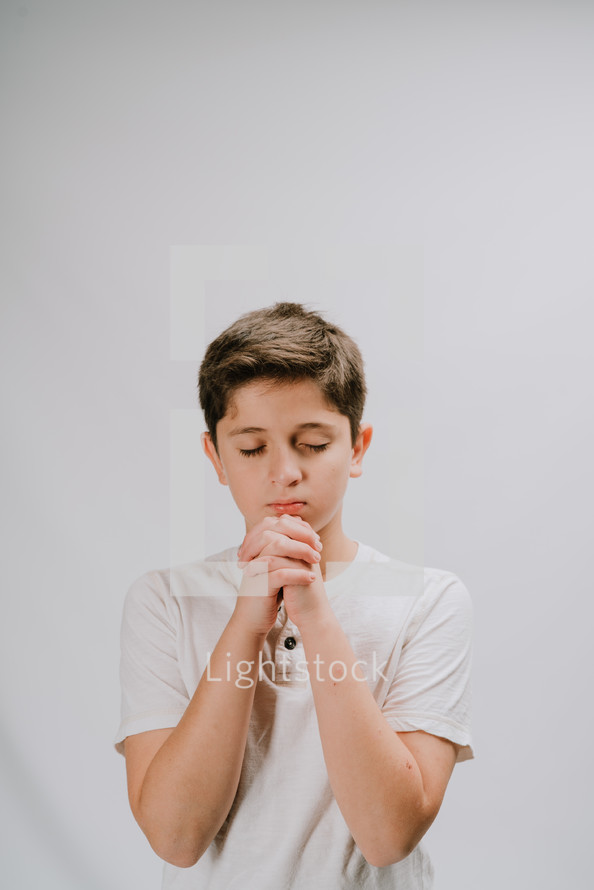 a praying boy 