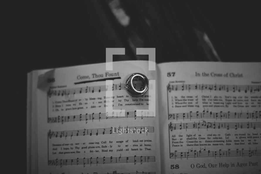 Wedding band on the pages of a hymnal