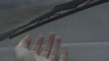 palm of a hand and windshield wipers 