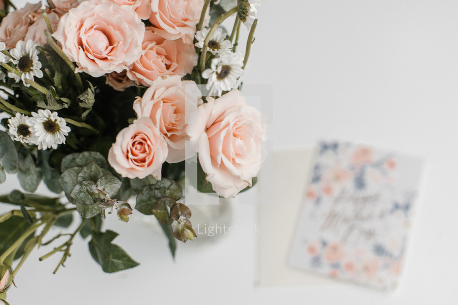 vase of flowers and a mother's day card 