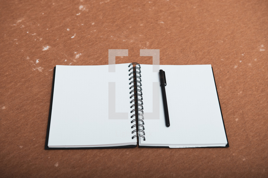 blank pages of an opened notebook 