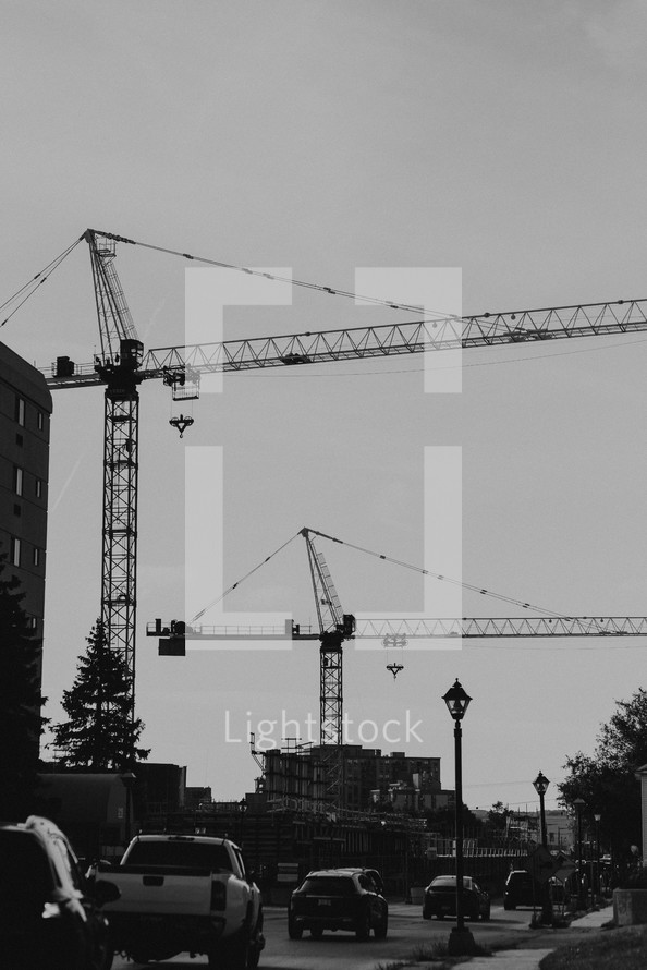 construction cranes in a city 