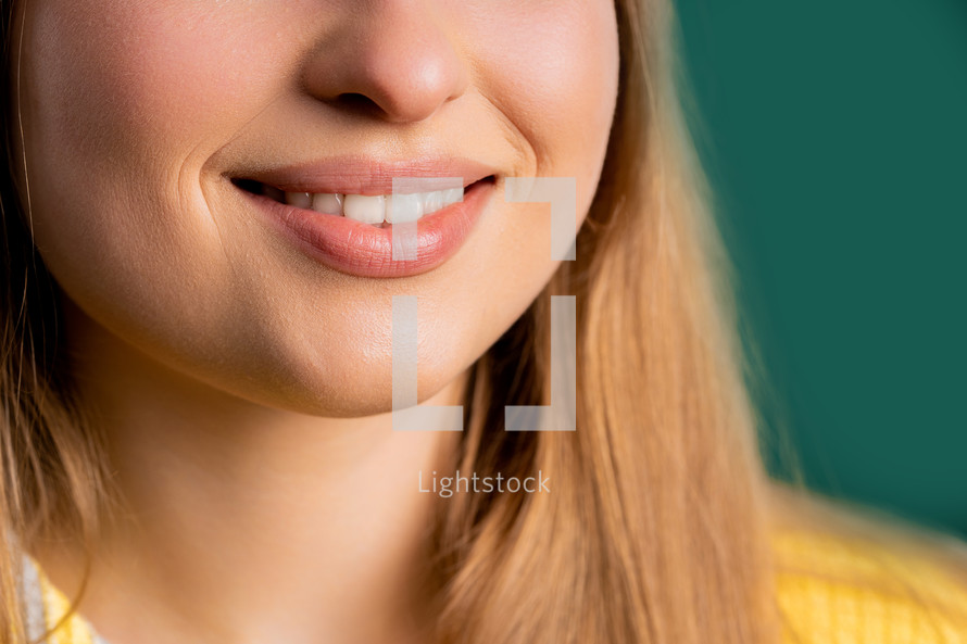 Mouth of charming smiling blonde woman. Perfect healthy teeth, lips, kind smile. High quality photo. High quality photo
