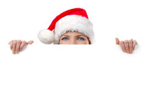 woman in a santa hat peeking 