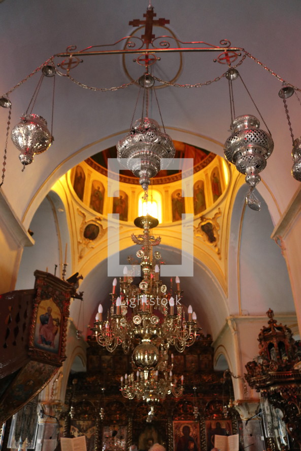 chandelier and incense burners in a cathedral 