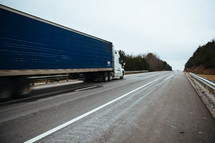 18-wheel cargo truck on a road.
