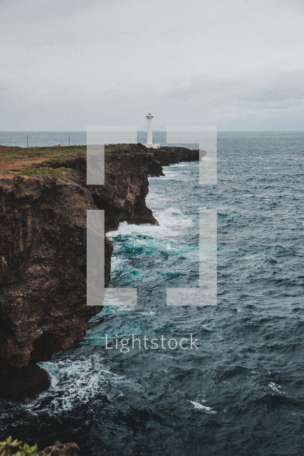lighthouse on a rock jetty 