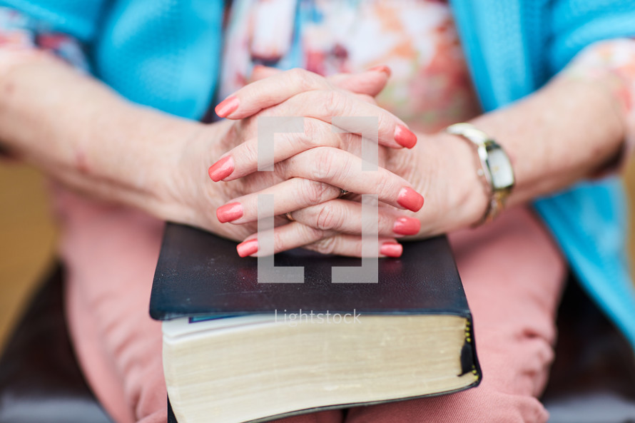 a woman with a Bible on her lap 
