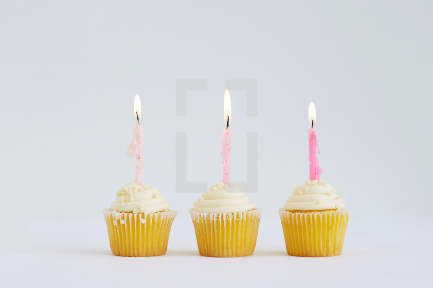 flames on candles on a birthday cupcake 