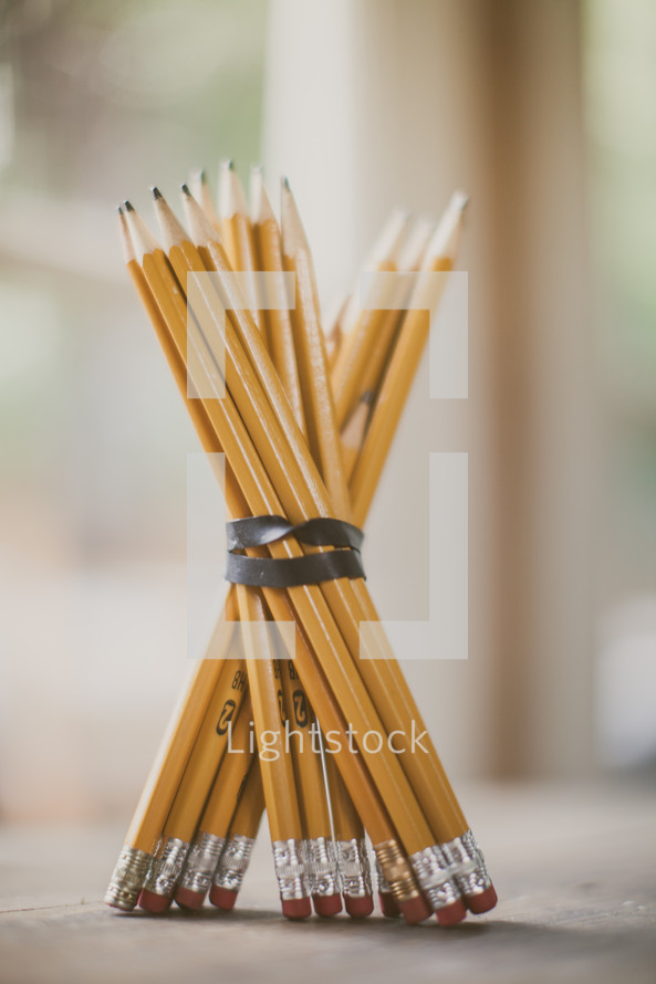 sharpened pencils rubber banded together 